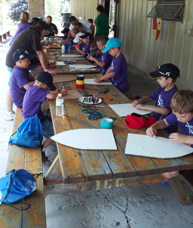 Every day during Theme we had a different theme-related craft. Here you see us making a medieval shield with our own custom herald. Every day during Theme we had a different theme-related craft. Here you see us making a medieval shield with our own custom herald.